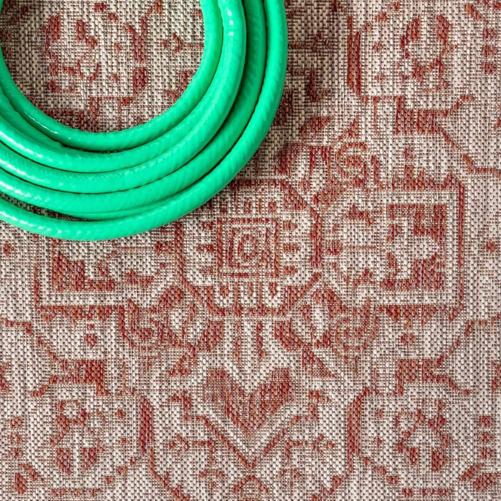 8'x10' Sinjuri Medallion Textured Weave Indoor/Outdoor Area Rug, Red/Taupe - JONATHAN Y