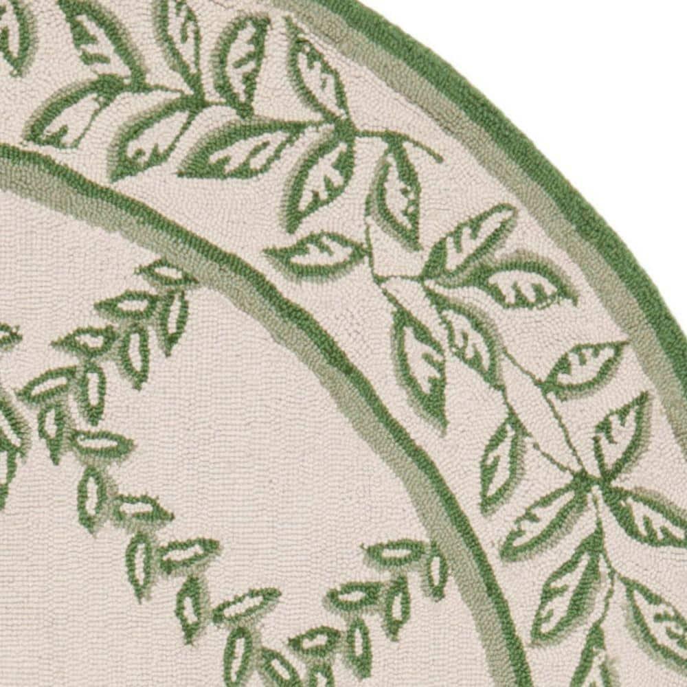 SAFAVIEH Chelsea Alecia Geometric Borders Wool Area Rug, Ivory/Light Green, 4'6"x6'6" Oval