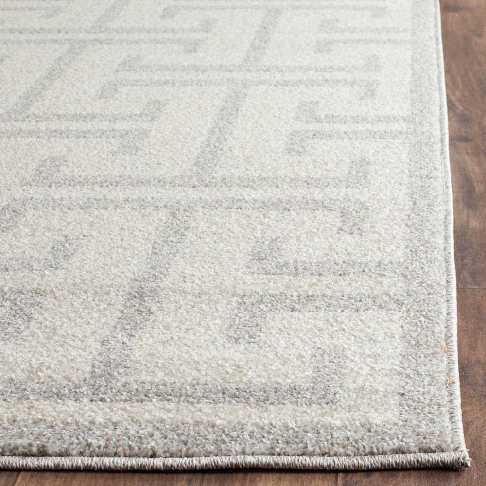 Ivory and Light Gray Rectangular 9' x 12' Synthetic Rug