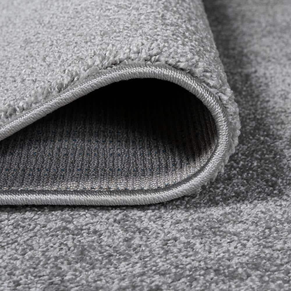 8'x10' Haze Solid Low-Pile Area Rug, Light Gray - JONATHAN Y