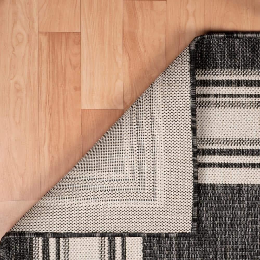 LR Home Kiara 7'6" x 9'5" Black/Gray/White Bordered Fade & Stain Resistant Indoor/Outdoor Area Rug