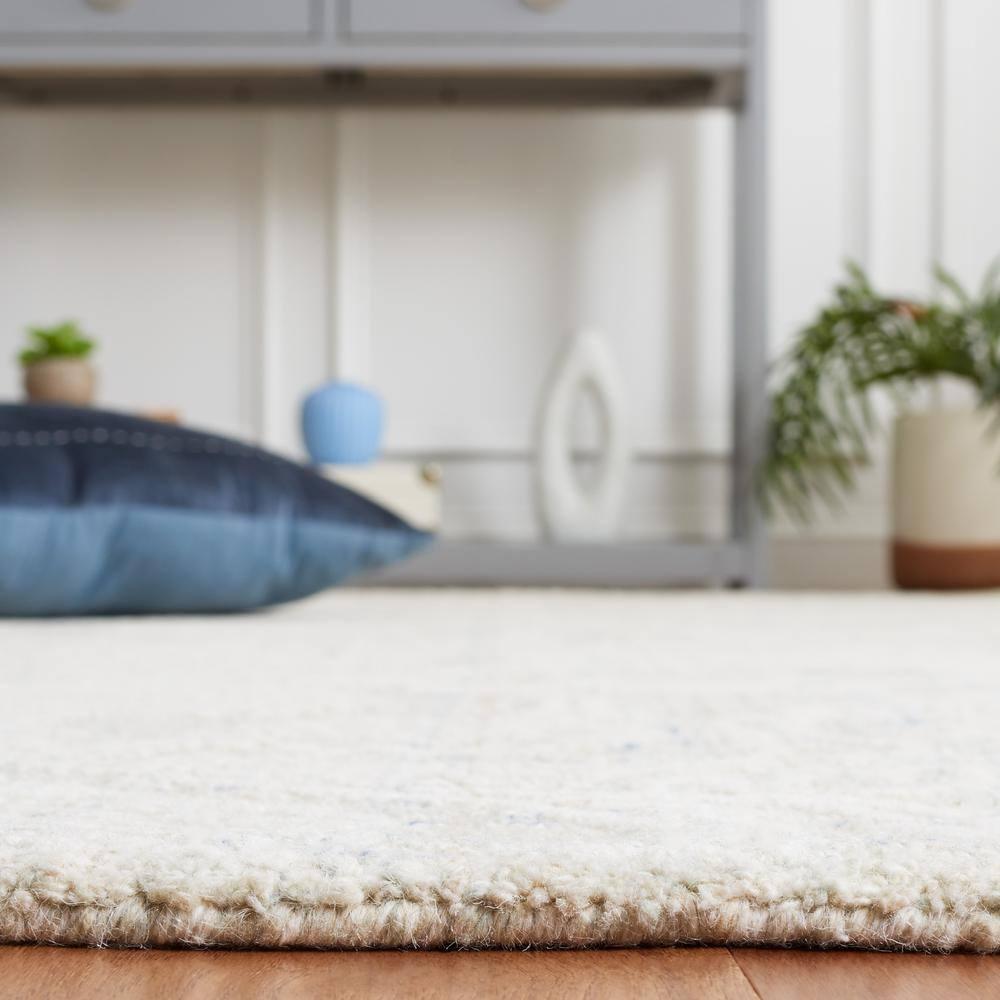 Ebony EBN111 Hand Tufted Area Rug - Blue/Ivory - 5'x8' - Safavieh.