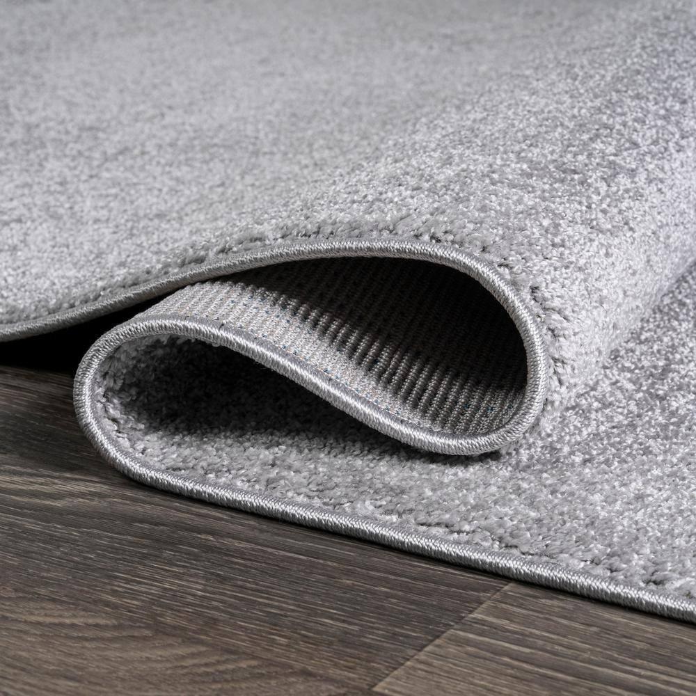 8'x10' Haze Solid Low-Pile Area Rug, Light Gray - JONATHAN Y