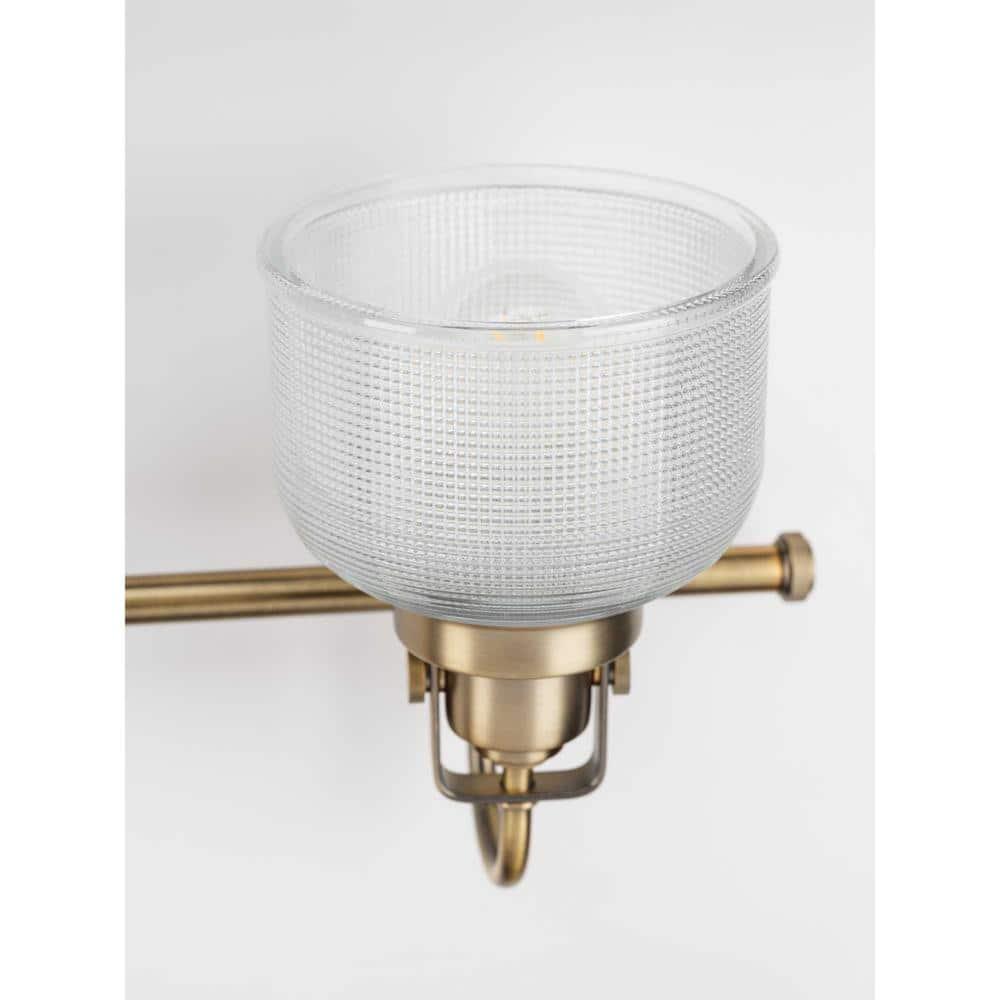 Archie Collection Four-Light Vintage Brass Clear Double Prismatic Glass Coastal Bath Vanity Light