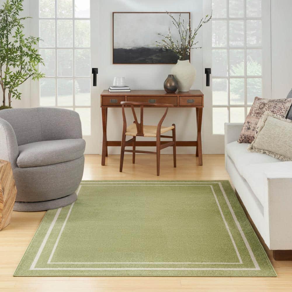 Nourison Essentials Solid Bordered Low Pile Indoor Outdoor Area Rug 5' x 7' Green Ivory