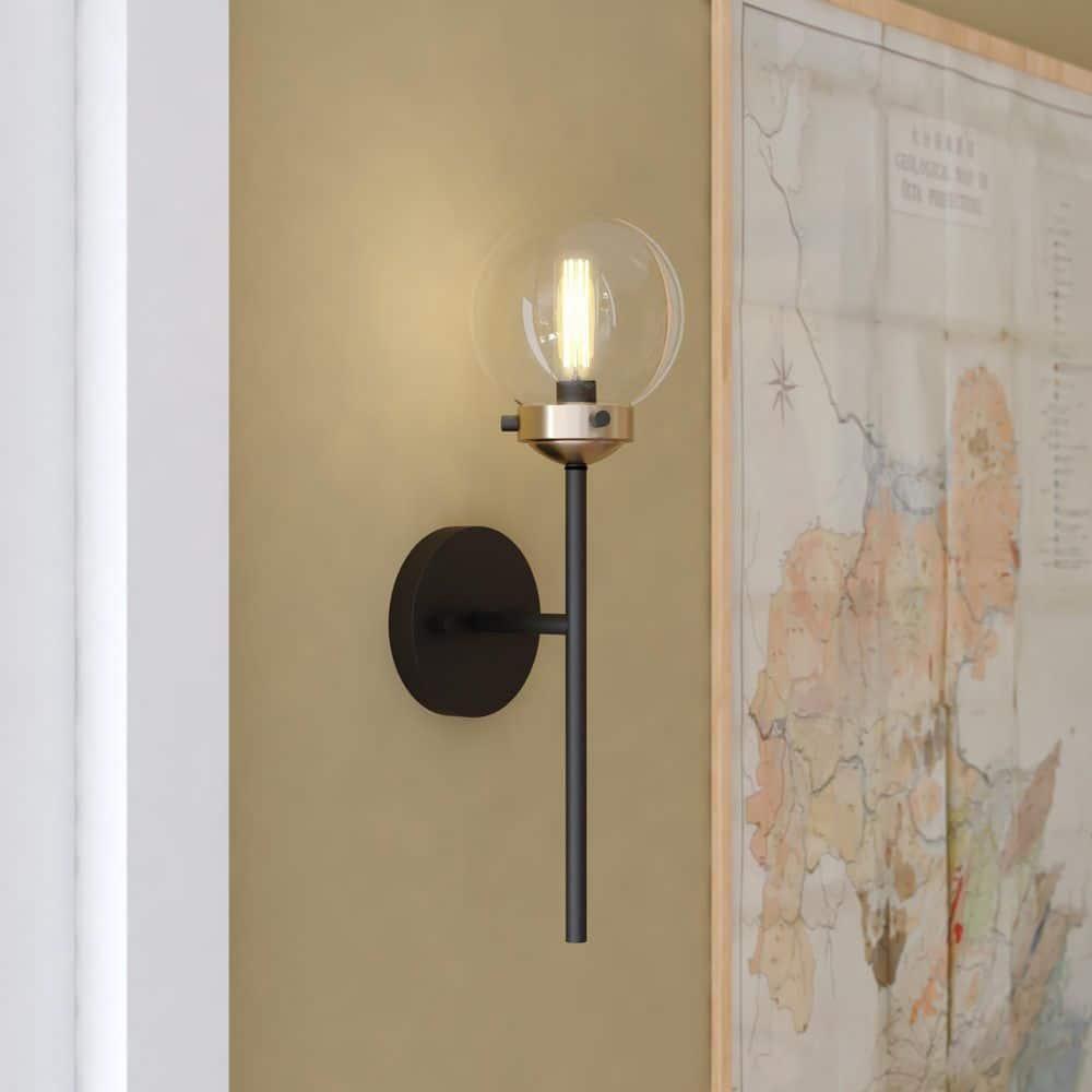 Vaxcel Orbit 1 Light Brass and Oil Rubbed Bronze Industrial MCM Wall Sconce Clear Glass Globe