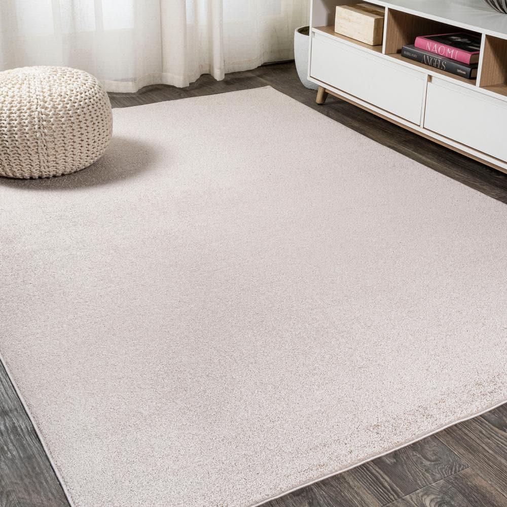 8'x10' Haze Solid Low-Pile Area Rug, Beige - JONATHAN Y
