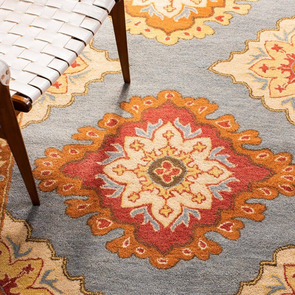 SAFAVIEH Heritage Lewis Traditional Wool Area Rug, Blue/Rust, 6' x 9'