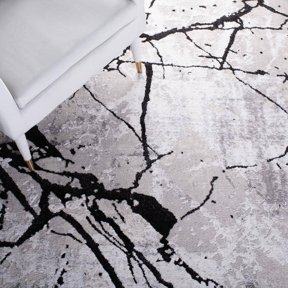 Handmade Round Gray and Black Abstract Synthetic Rug