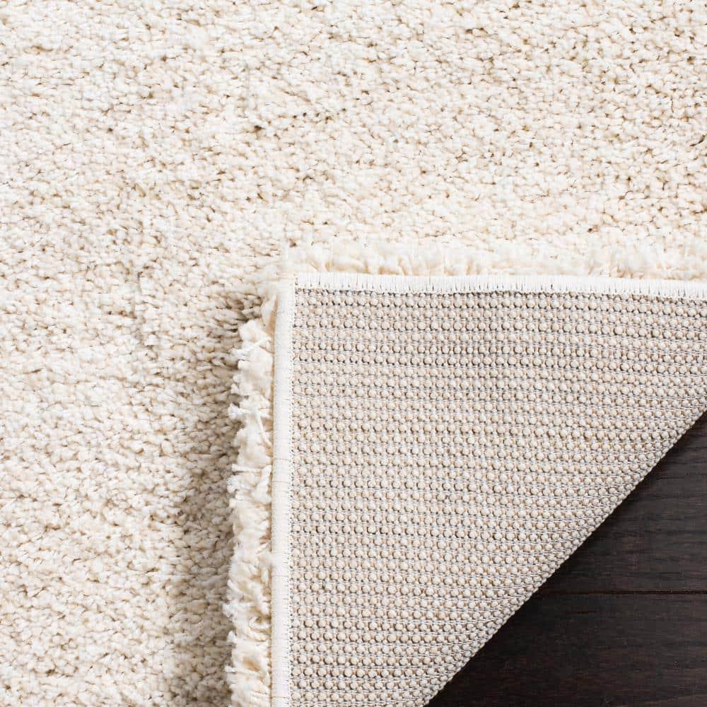 SAFAVIEH Milan Harlow Solid Plush Shag Area Rug, Ivory, 10' x 14'