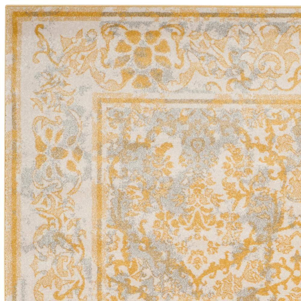 SAFAVIEH Evoke Lorna Traditional Bordered Area Rug, Ivory/Gold, 9' x 12'