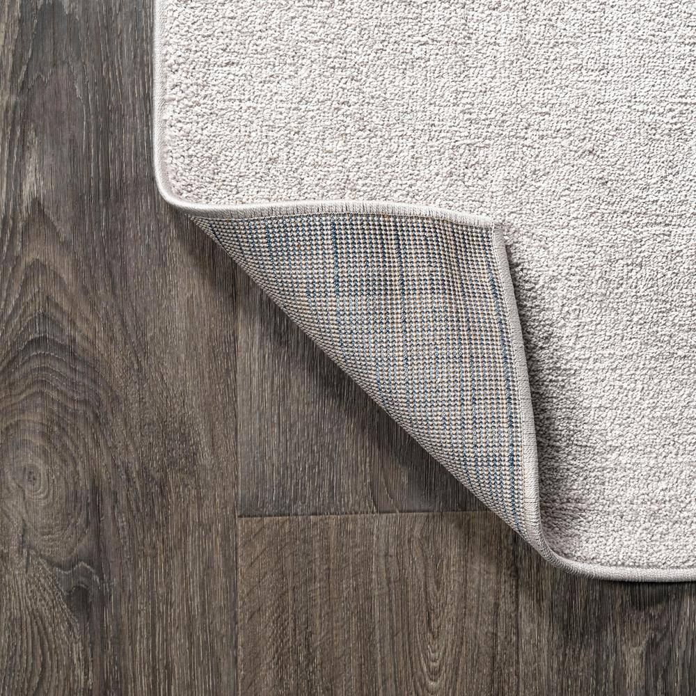 8'x10' Haze Solid Low-Pile Area Rug, Ivory - JONATHAN Y