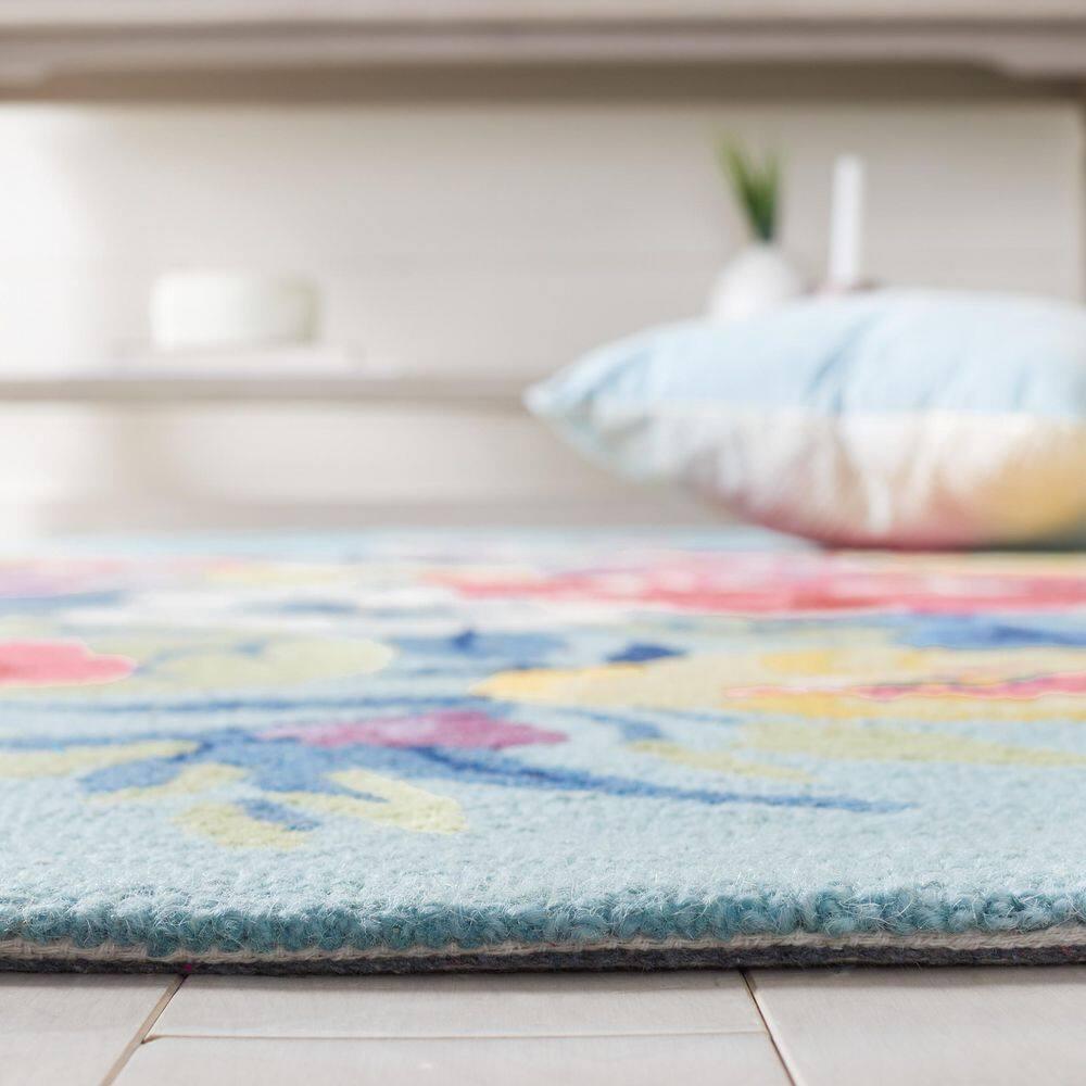 Chelsea HK219 Hand Tufted Area Rug - Blue/Rose - 6'x9' Oval - Safavieh.