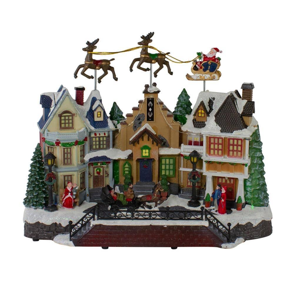 Northlight Seasonal 16" White and Brown LED Lighted and Animated Christmas Village with Flying Sleigh Tabletop Decor