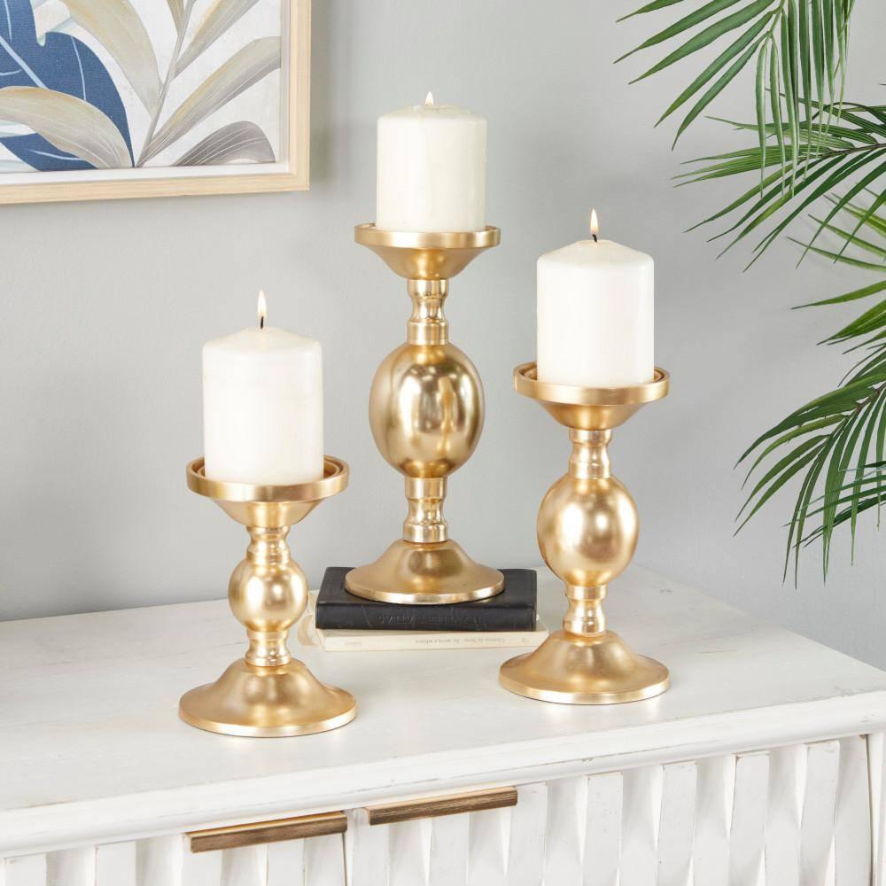 Deco 79 Aluminum Metal Decorative Candle Holder Pillar Candle Stand, Set of 3 Candlestick Holder 10", 8", 6"H, Gold