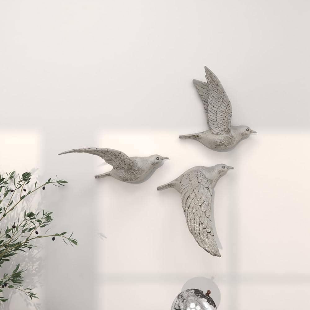 DecMode Silver Polystone Metallic 3D Sculpted Bird Wall Decor (3 Count)