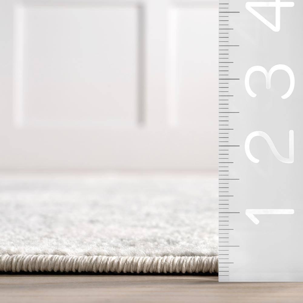 nuLOOM Odell Faded Vintage Ivory 6' 7" x 9' Vintage Area Rug