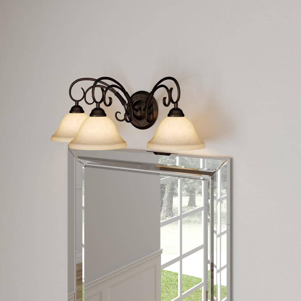 Golden Lighting Homestead 3-Light Vanity Light in Rubbed Bronze with Tea Stone Glass