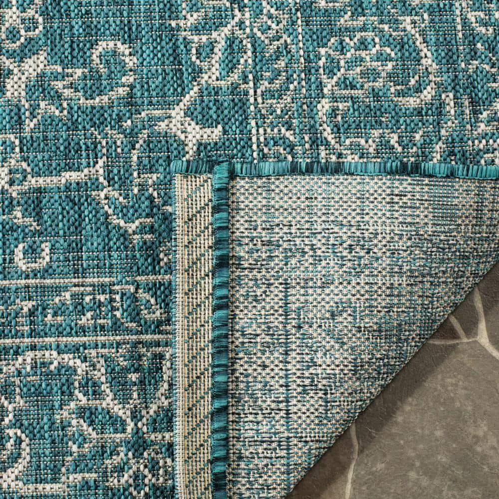 SAFAVIEH Courtyard Darin Botanical Indoor/Outdoor Area Rug, Turquoise, 6'7" x 6'7" Round