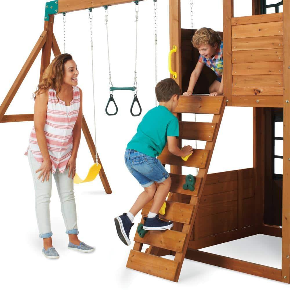 KidKraft Treasure Cove Wooden Swing Set with Slides and Rock Wall