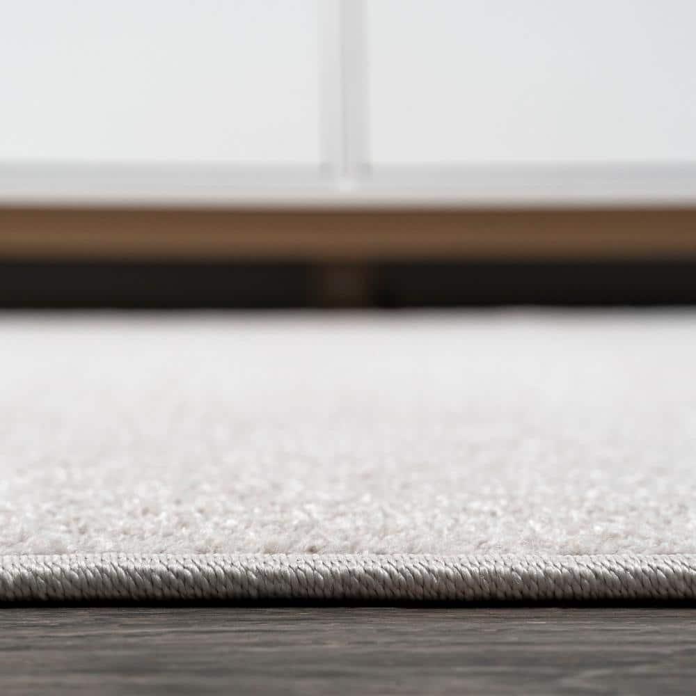 8'x10' Haze Solid Low-Pile Area Rug, Ivory - JONATHAN Y