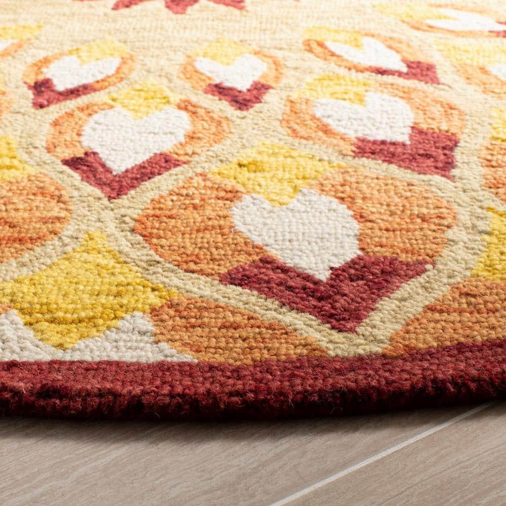 Novelty NOV603 Hand Tufted Area Rug - Rust/Gold - 5' round - Safavieh.