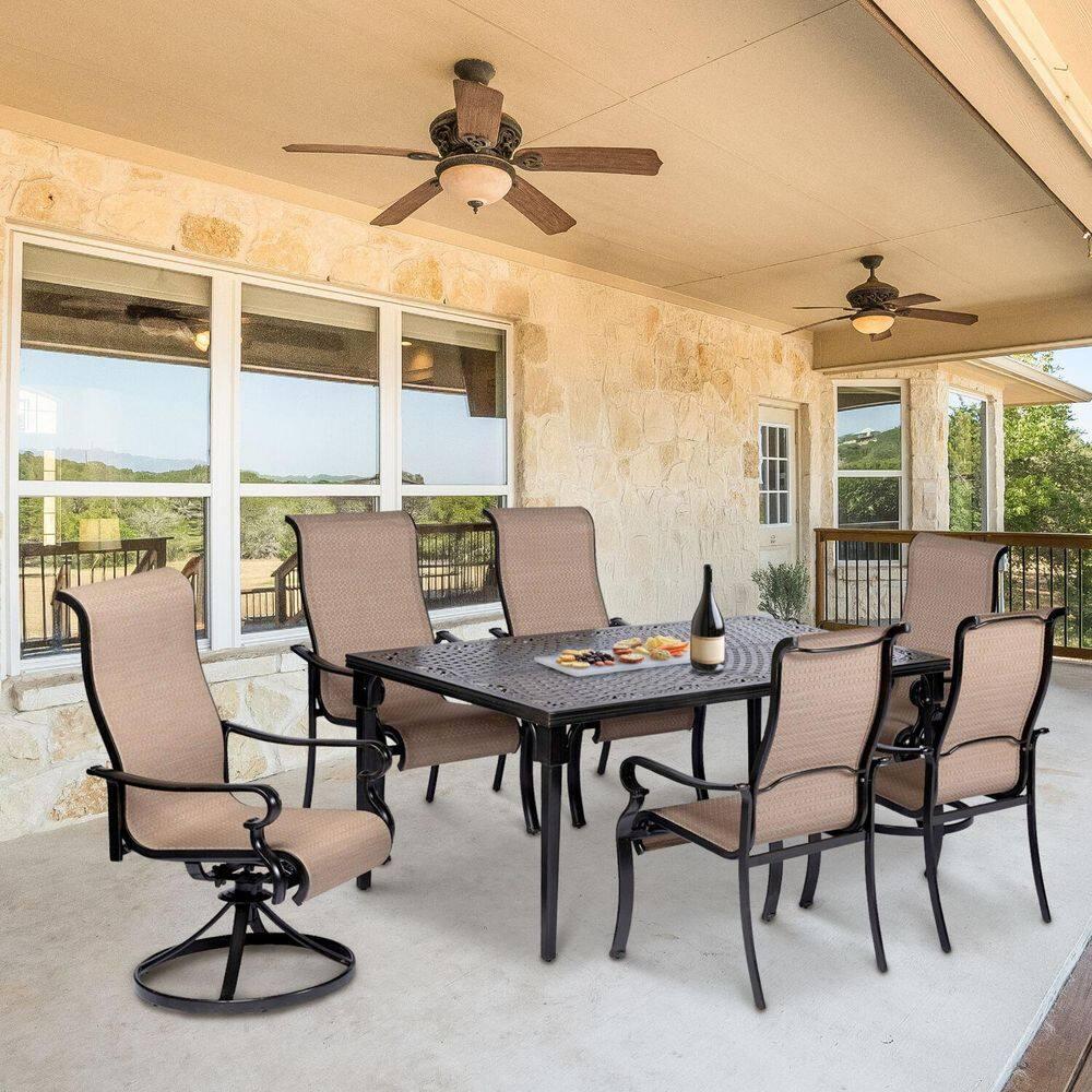 Hanover Brigantine Juego de Comedor Moderno para Exteriores de 7 Piezas / 4 Sillas con Cabestrillo, 2 Balancines Giratorios / Mesa con Tapa de 40'' x 70'' / Clima, Xido, Resistente a UV / Bronceado / BRIGDN7PCSW-2