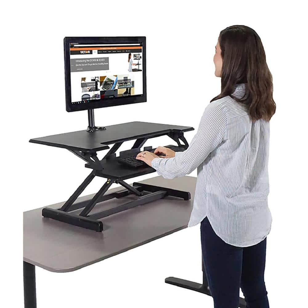 Victor DCX610 Height Adjustable Compact Standing Desk| Black| 33” Wide Sit-Stand Dual Monitor Desk and Laptop Riser Workstation| Compatible with Most Monitor Arms