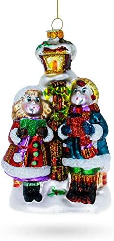 Carolers by a Vintage Lantern Blown Glass Christmas Ornament