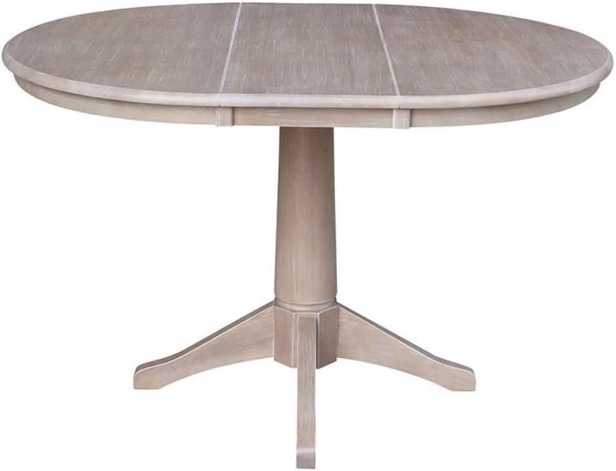36" Magnolia Round Top Dining Table with 12" Leaf Washed Gray Taupe - International Concepts: Hardwood Pedestal Base, Seats 4