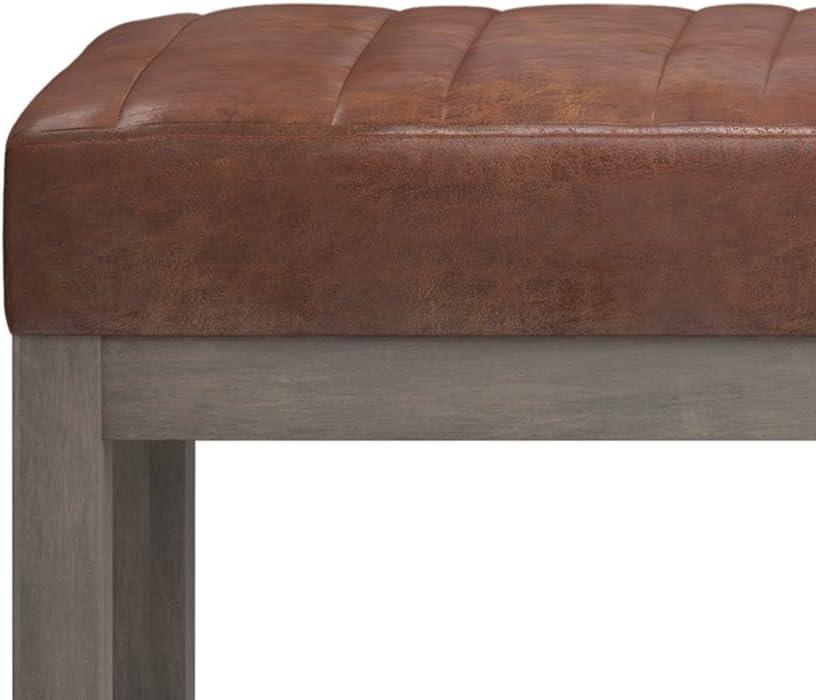 Simpli Home Casey 48" Wd. Ottoman Bench in Distressed Saddle Brown Faux Leather