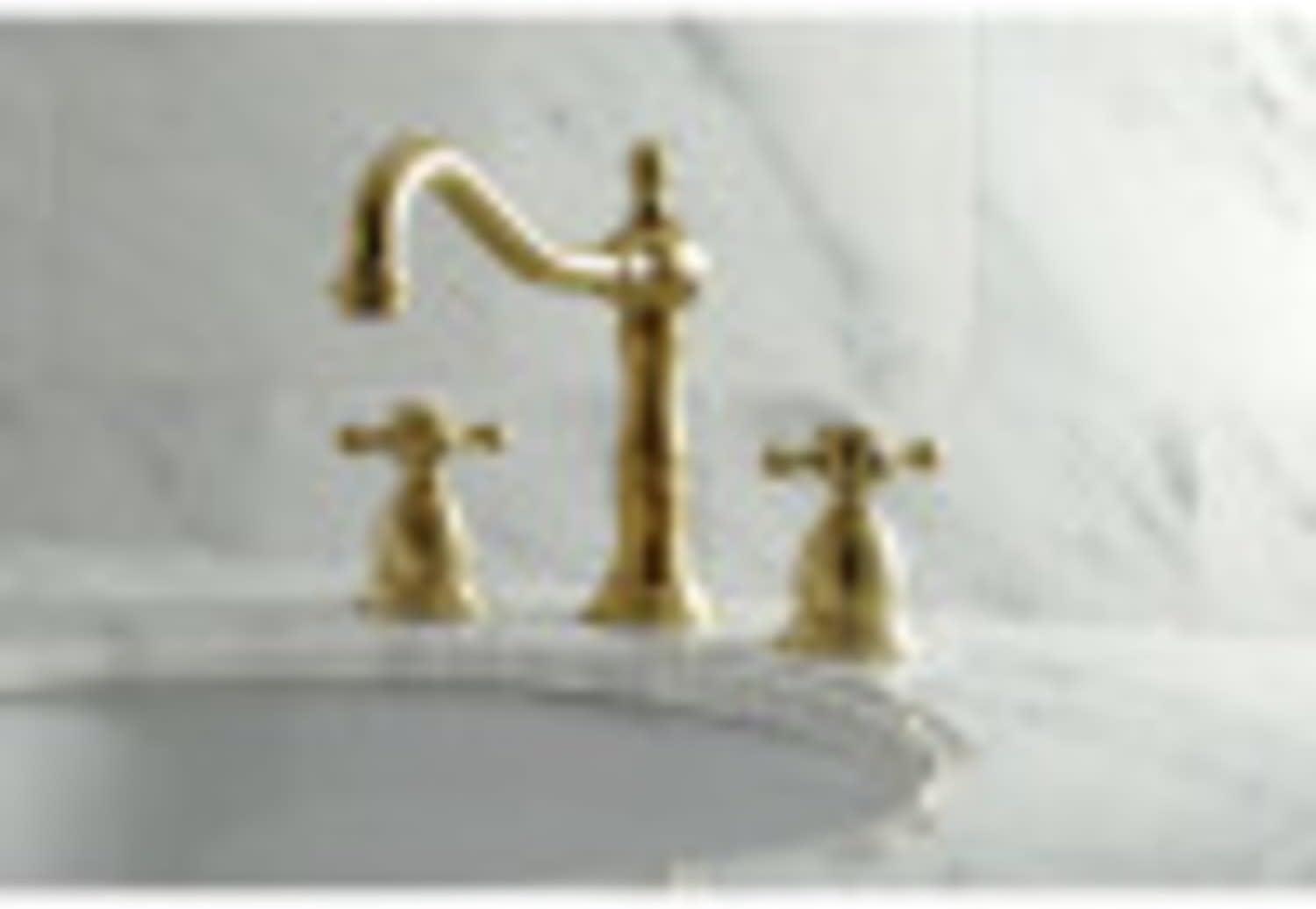 Kingston Brass Heritage Two-Handle 3-Hole Deck Mount Widespread Bathroom Faucet with Brass Pop-Up Drain