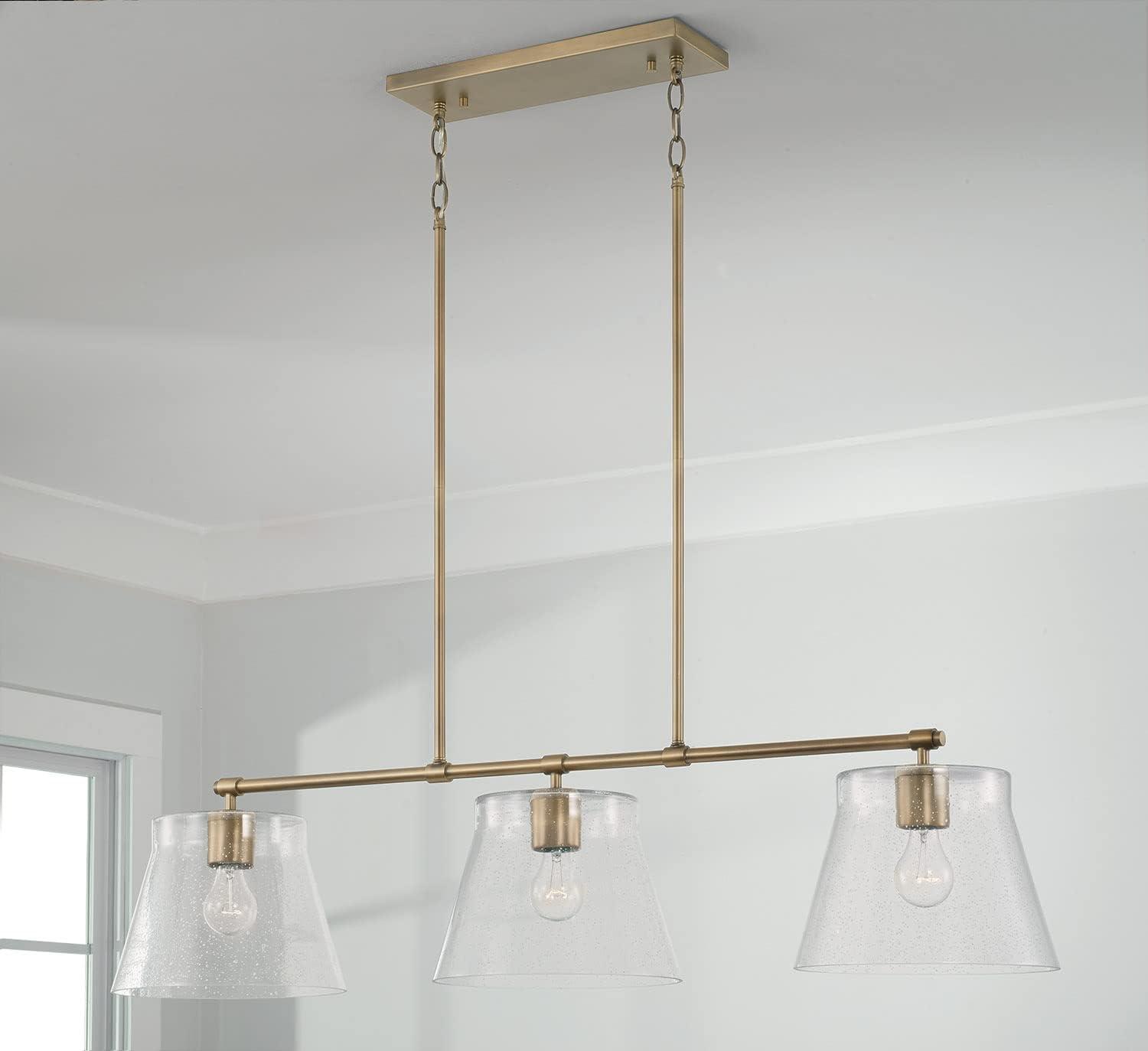 Aged Brass 3-Light Island Pendant with Seeded Glass Shades