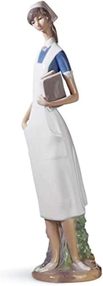 Matte White Porcelain Nurse Figurine with Delicate Petal Details