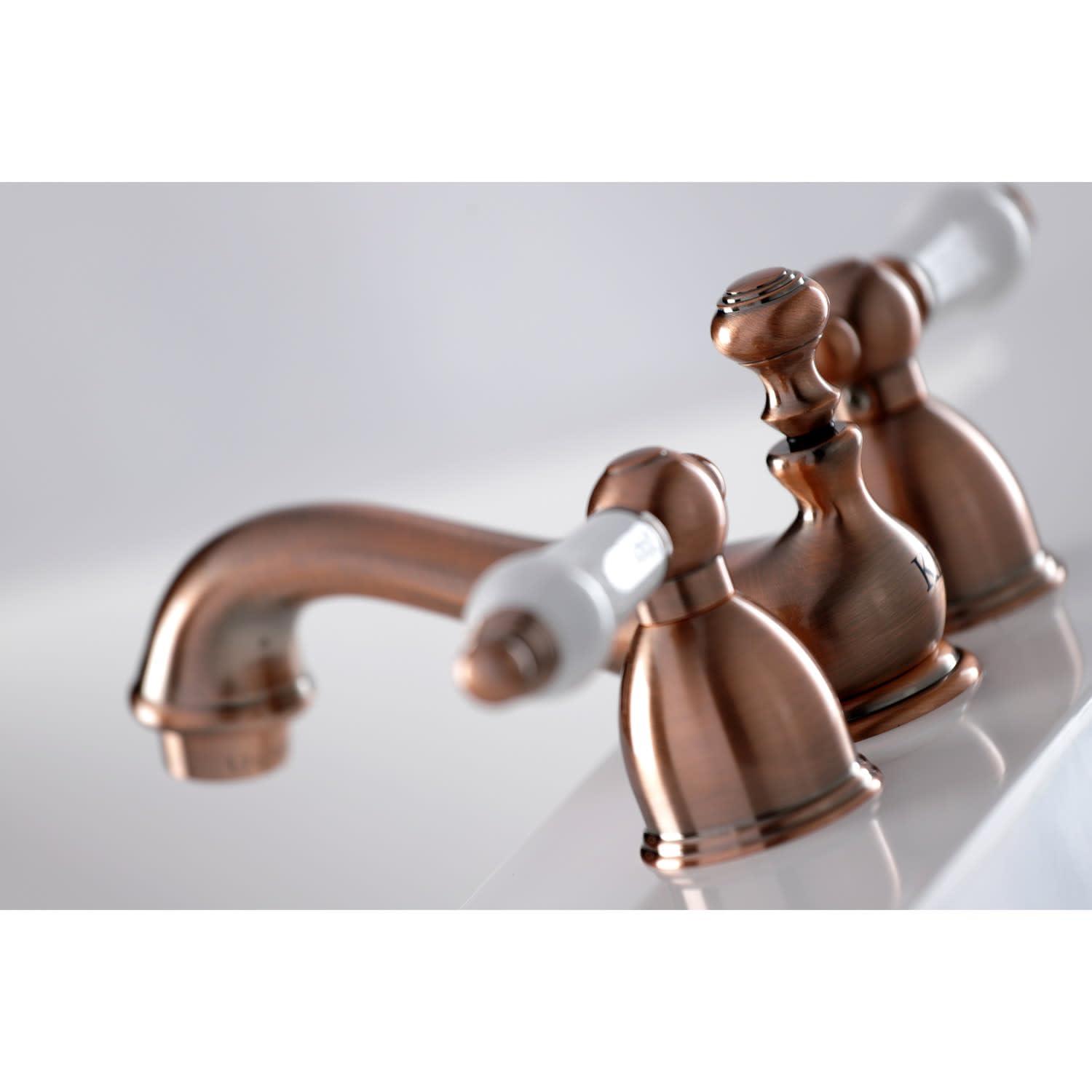 Kingston Brass Restoration Two-Handle 3-Hole Deck Mount Mini-Widespread Bathroom Faucet with Brass Pop-Up