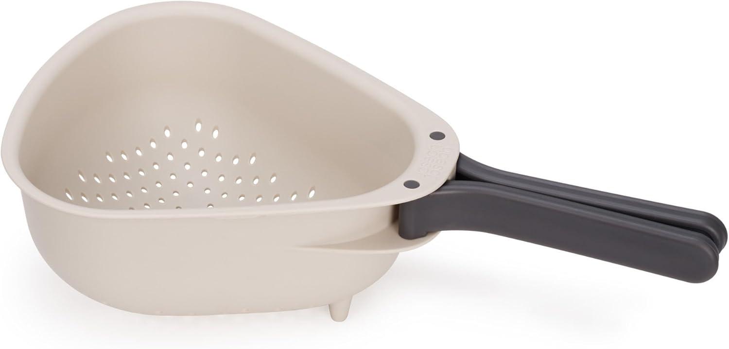 Compact Beige and Black Plastic Colander with Folding Handles