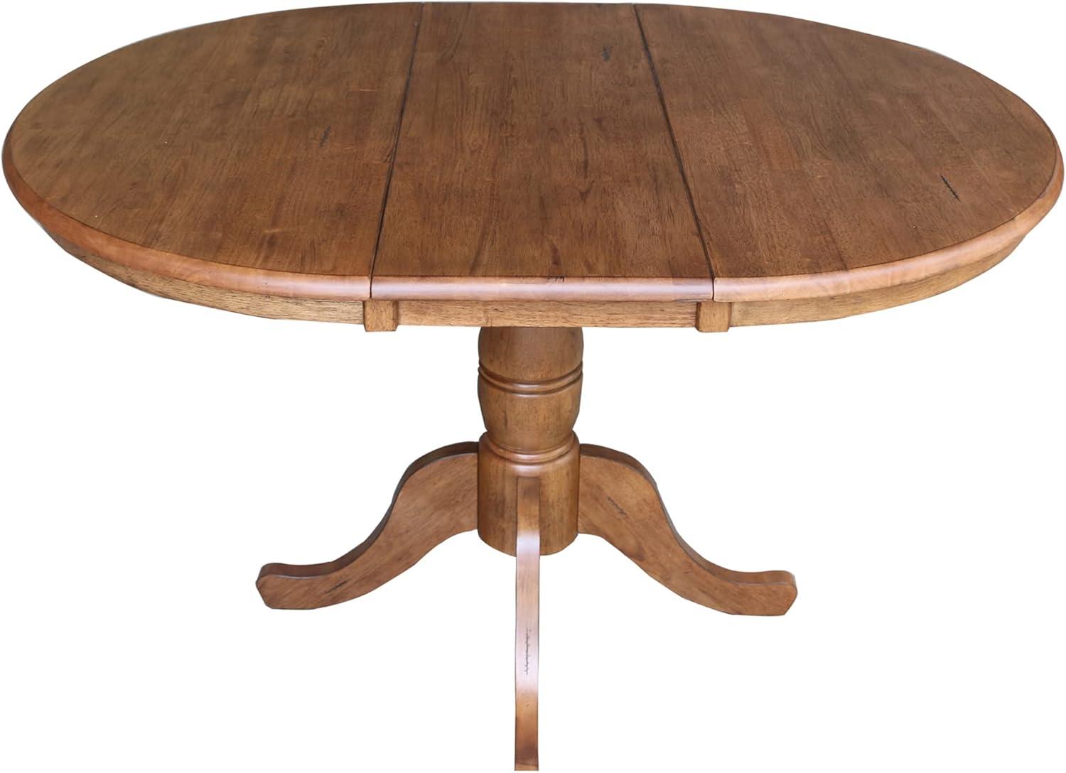 Keanan Round Top Pedestal Table with 12" Drop Leaf Distressed Oak - International Concepts