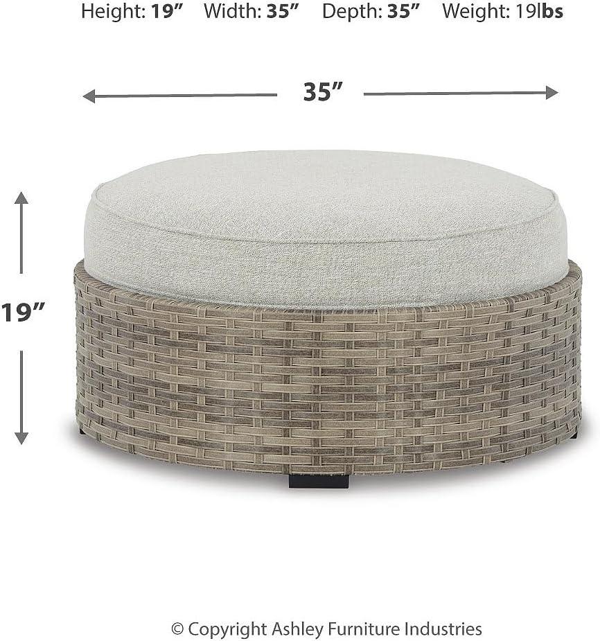 Calworth Handwoven Wicker Outdoor Ottoman with Performance Beige Cushion