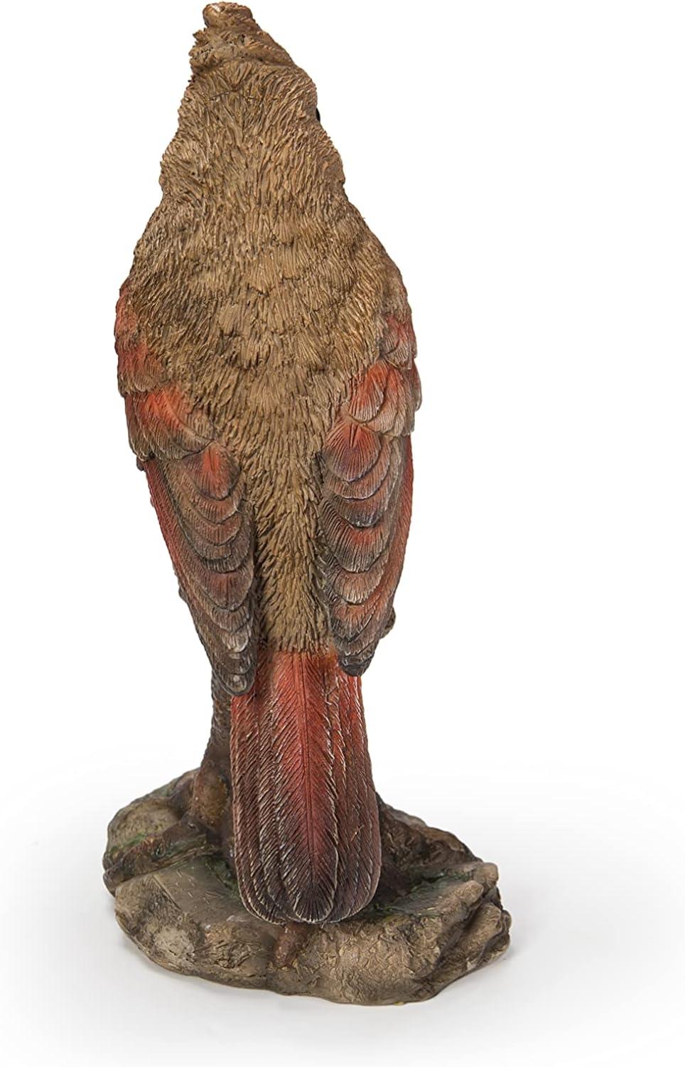 Female Cardinal Perched On A Stump Statue