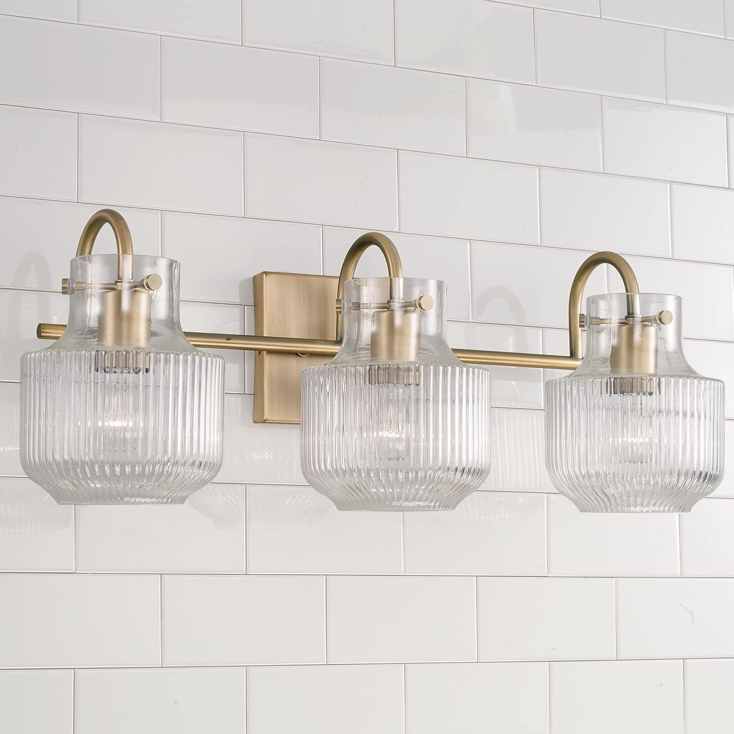 Aged Brass 3-Light Vanity with Clear Fluted Glass Shades