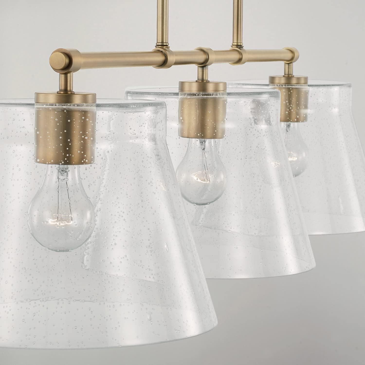 Aged Brass 3-Light Island Pendant with Seeded Glass Shades