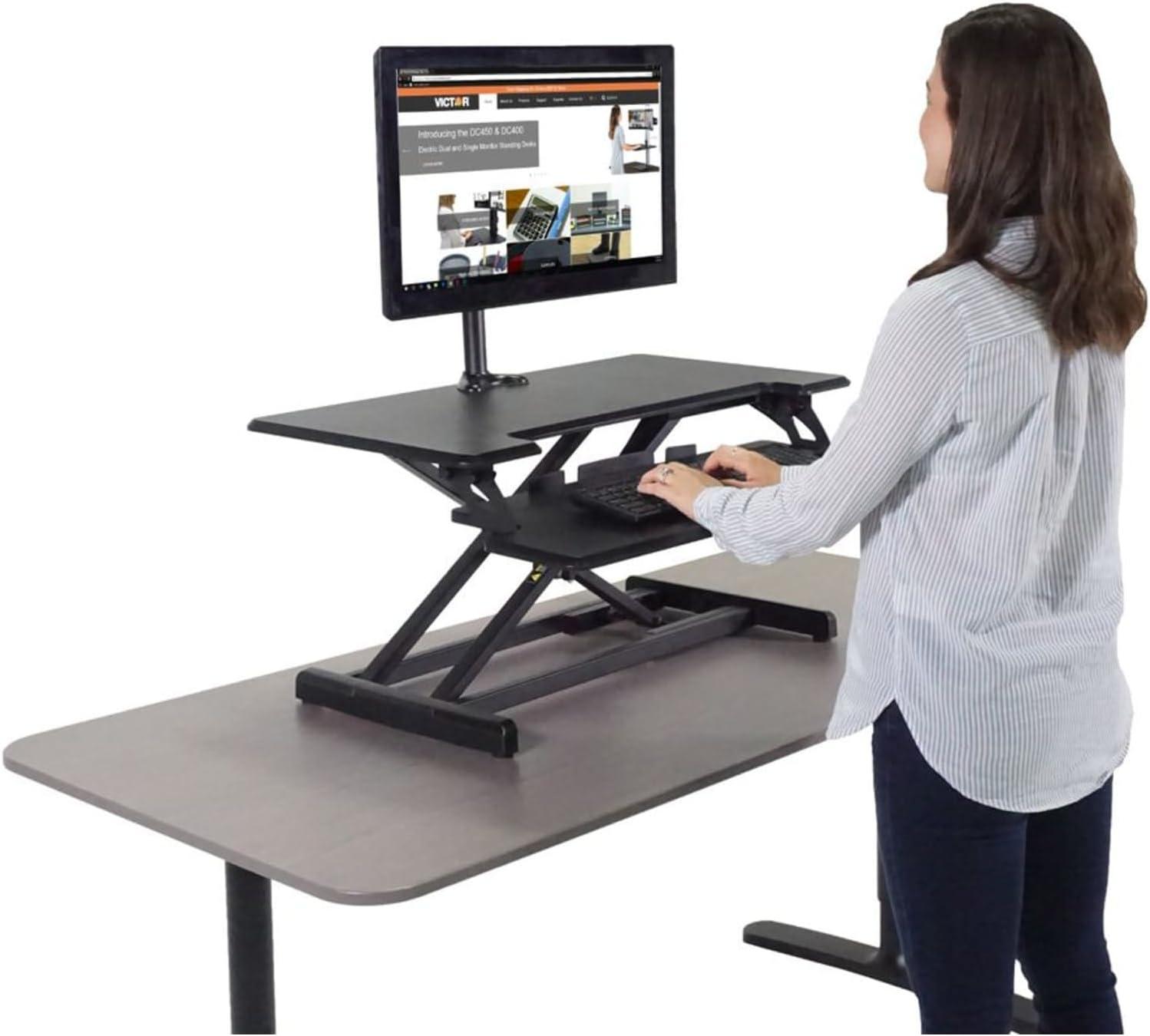Victor DCX610 Height Adjustable Compact Standing Desk| Black| 33” Wide Sit-Stand Dual Monitor Desk and Laptop Riser Workstation| Compatible with Most Monitor Arms