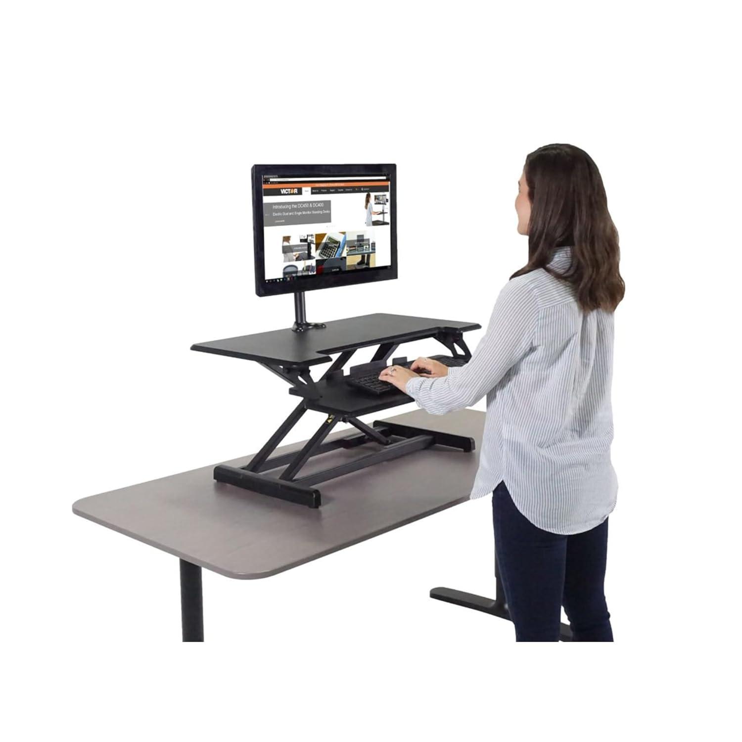 Victor DCX610 Height Adjustable Compact Standing Desk| Black| 33” Wide Sit-Stand Dual Monitor Desk and Laptop Riser Workstation| Compatible with Most Monitor Arms