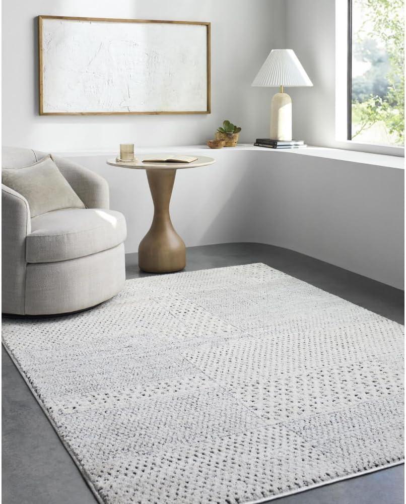 Ivory and Black Geometric Patchwork Area Rug, 6'7" x 9'