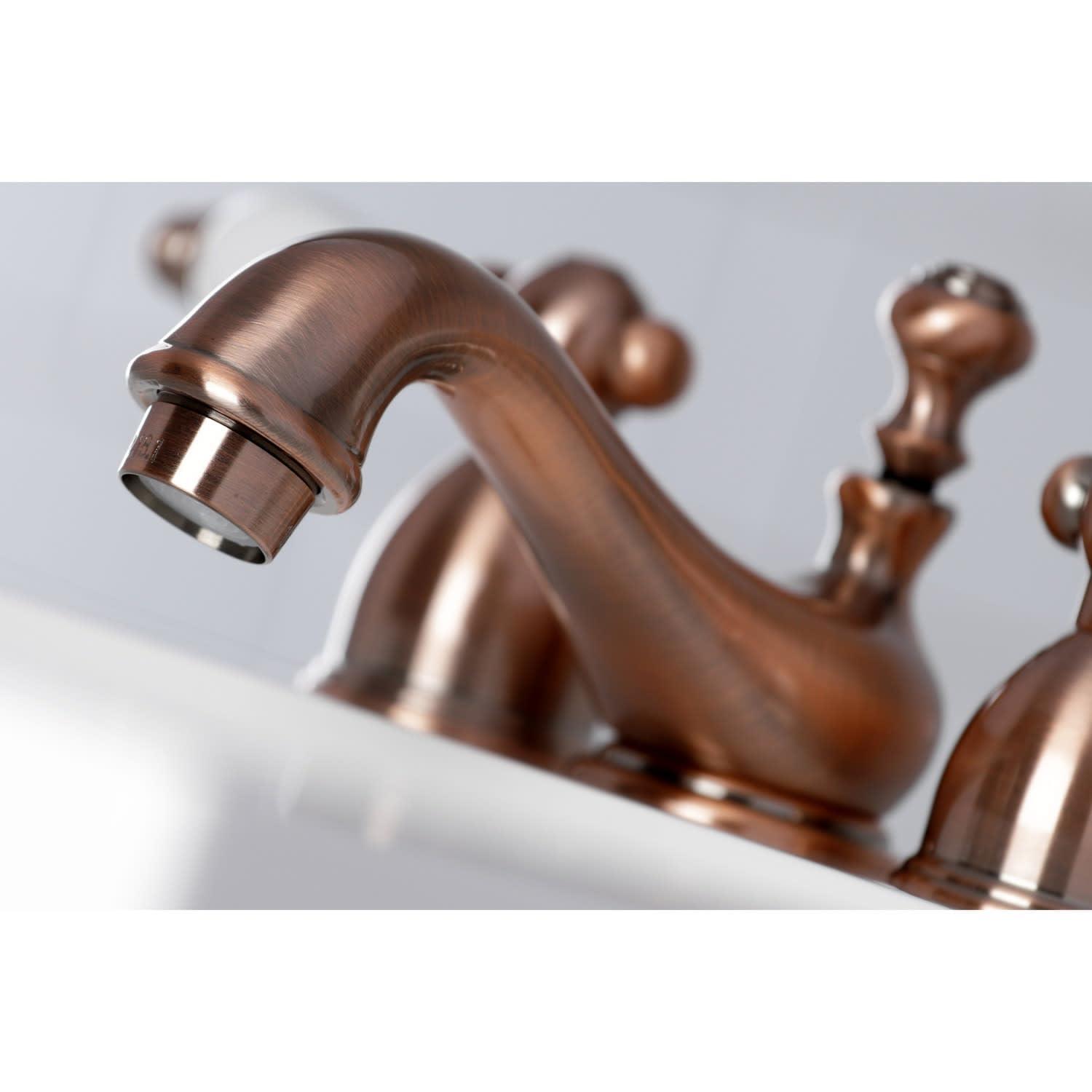 Kingston Brass Restoration Two-Handle 3-Hole Deck Mount Mini-Widespread Bathroom Faucet with Brass Pop-Up