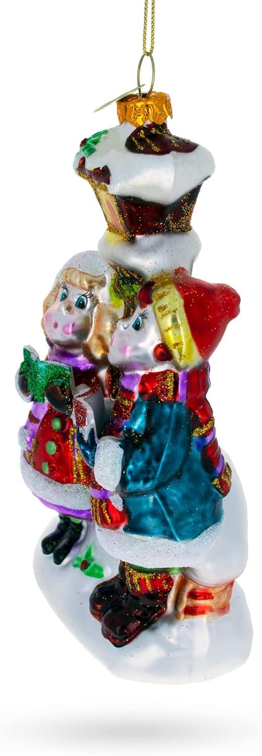 Carolers by a Vintage Lantern Blown Glass Christmas Ornament