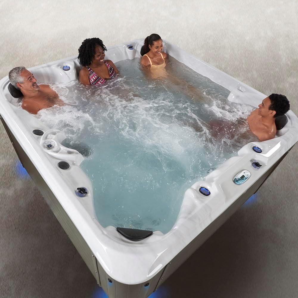 Amplified 6-Person 100-Jet Lounger Hot Tub Spa with Bluetooth Stereo, 3 Pumps, LED Lighting, Stainless Steel Heater and Ozonator, Insulated Cover Included and Steps Included, Made in USA