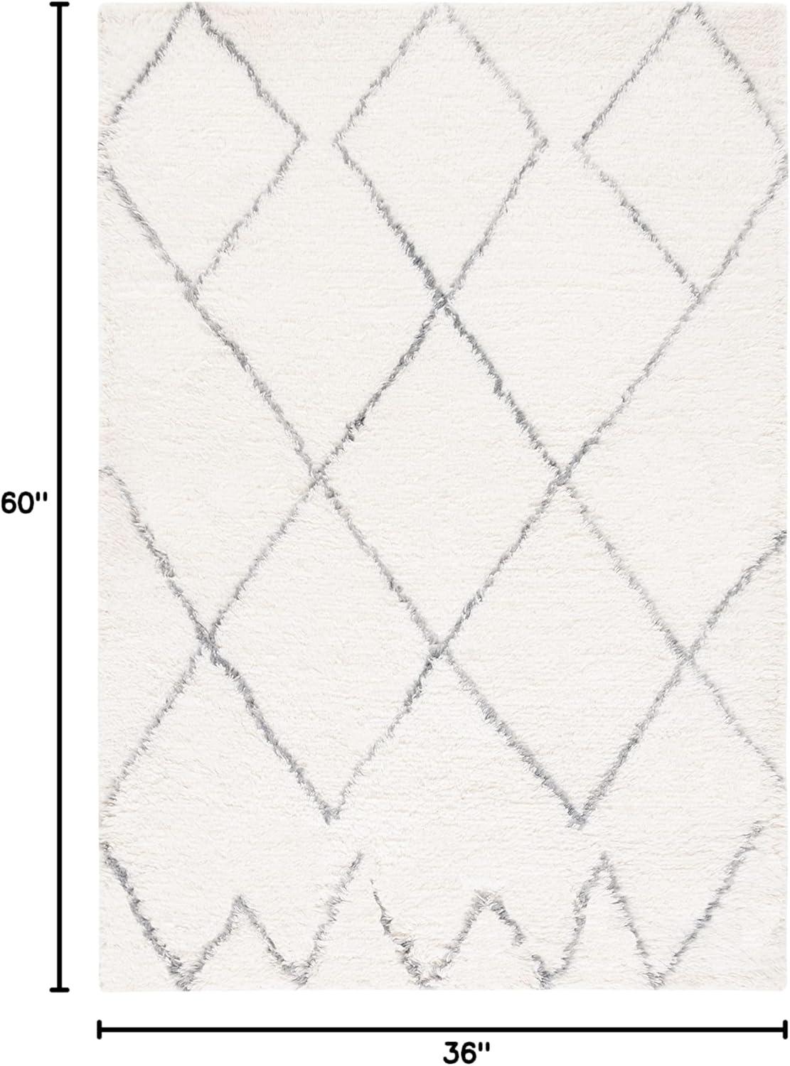Henrie Geometric Handwoven Area Rug in Ivory/Gray