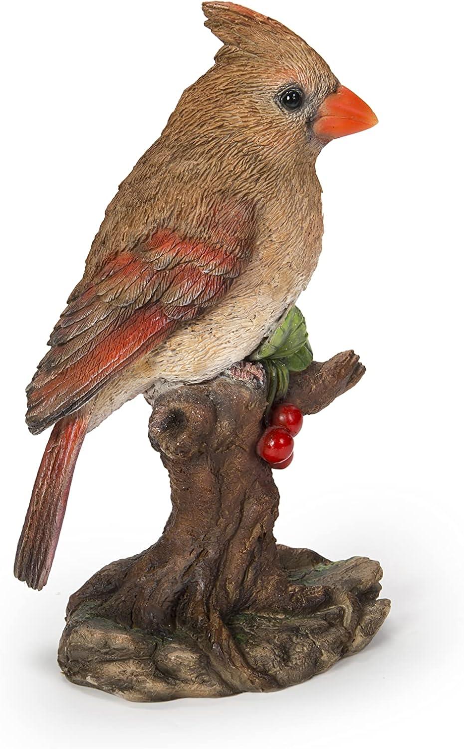 Female Cardinal Perched On A Stump Statue