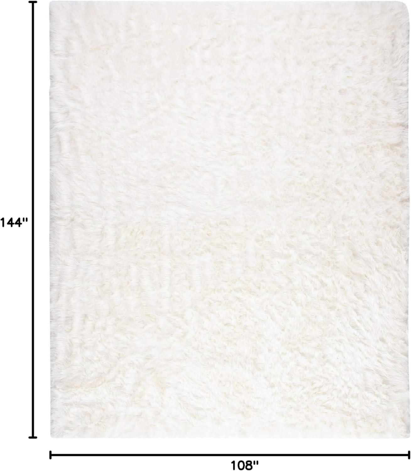 SAFAVIEH Faux Sheep Skin Vesna Solid Plush Area Rug, Ivory, 9' x 12'